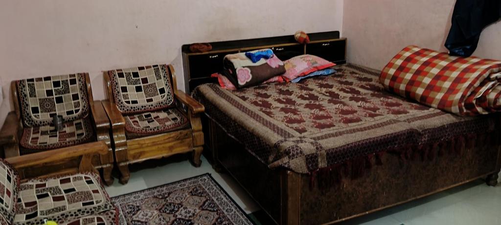 Ένα ή περισσότερα κρεβάτια σε δωμάτιο στο Home stay