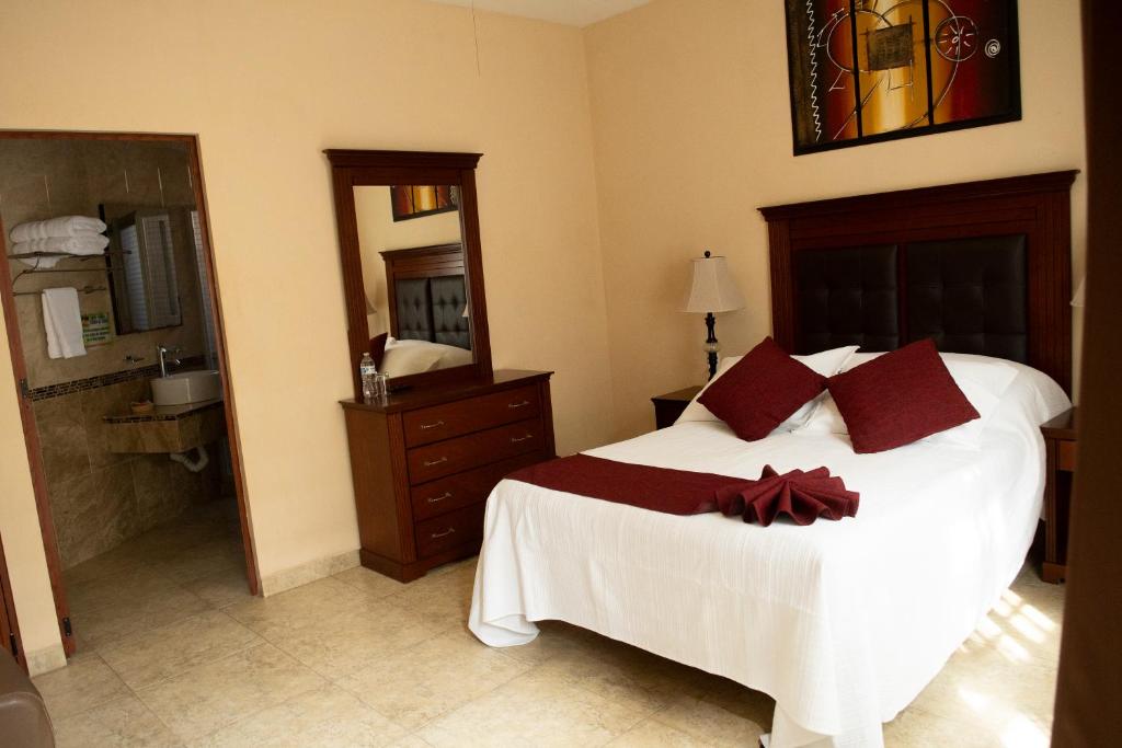 Postel nebo postele na pokoji v ubytování Hotel Villa Bernal