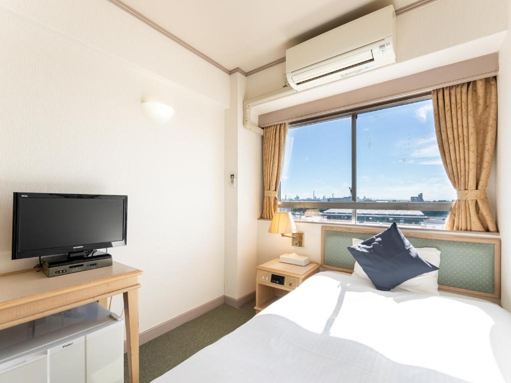 TV a/nebo společenská místnost v ubytování Tabist Hotel Ginga Kisarazu