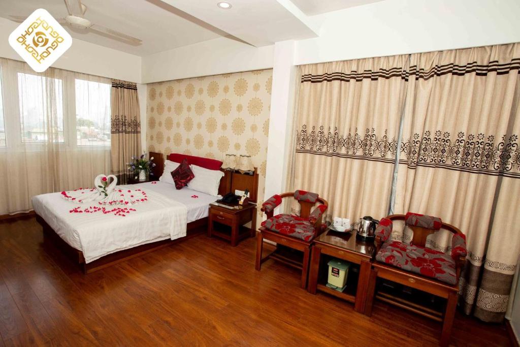 Postel nebo postele na pokoji v ubytování Hoa Hồng Hotel 2 - Xã Đàn