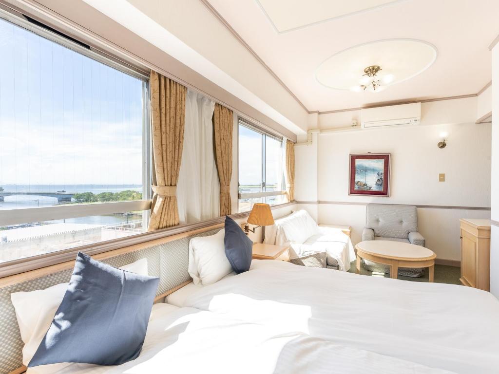 Postel nebo postele na pokoji v ubytování Tabist Hotel Ginga Kisarazu