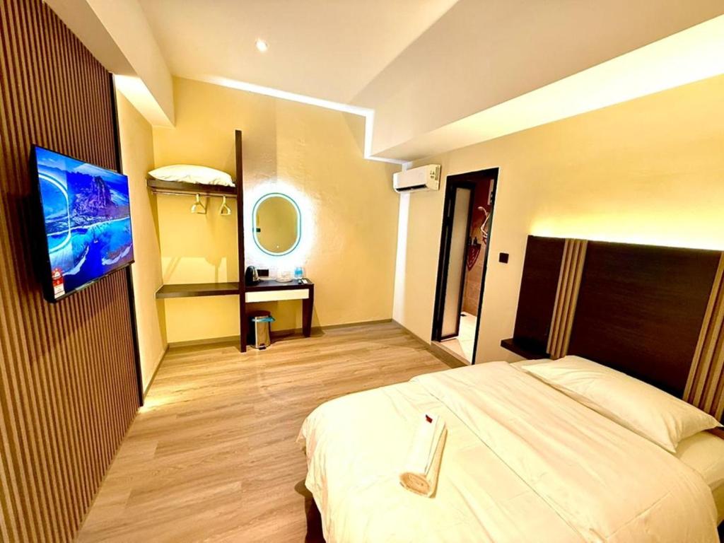 Postel nebo postele na pokoji v ubytování Hota Inn Limbang