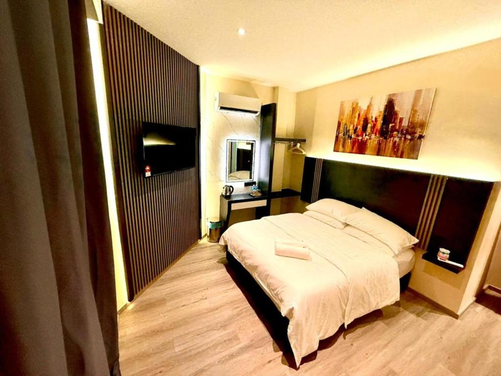Postel nebo postele na pokoji v ubytování Hota Inn Limbang