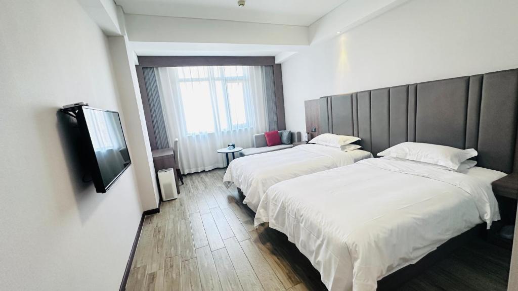 Postel nebo postele na pokoji v ubytování Bestway Hotel Xi'an