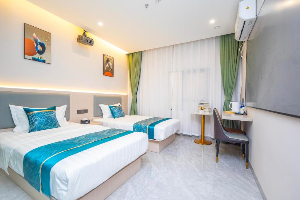 Postel nebo postele na pokoji v ubytování Zhuhai Xiangzhou Yijing Express Hotel