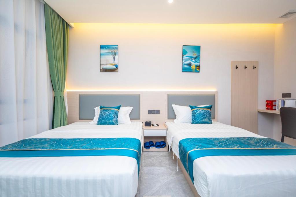 Postel nebo postele na pokoji v ubytování Zhuhai Xiangzhou Yijing Express Hotel