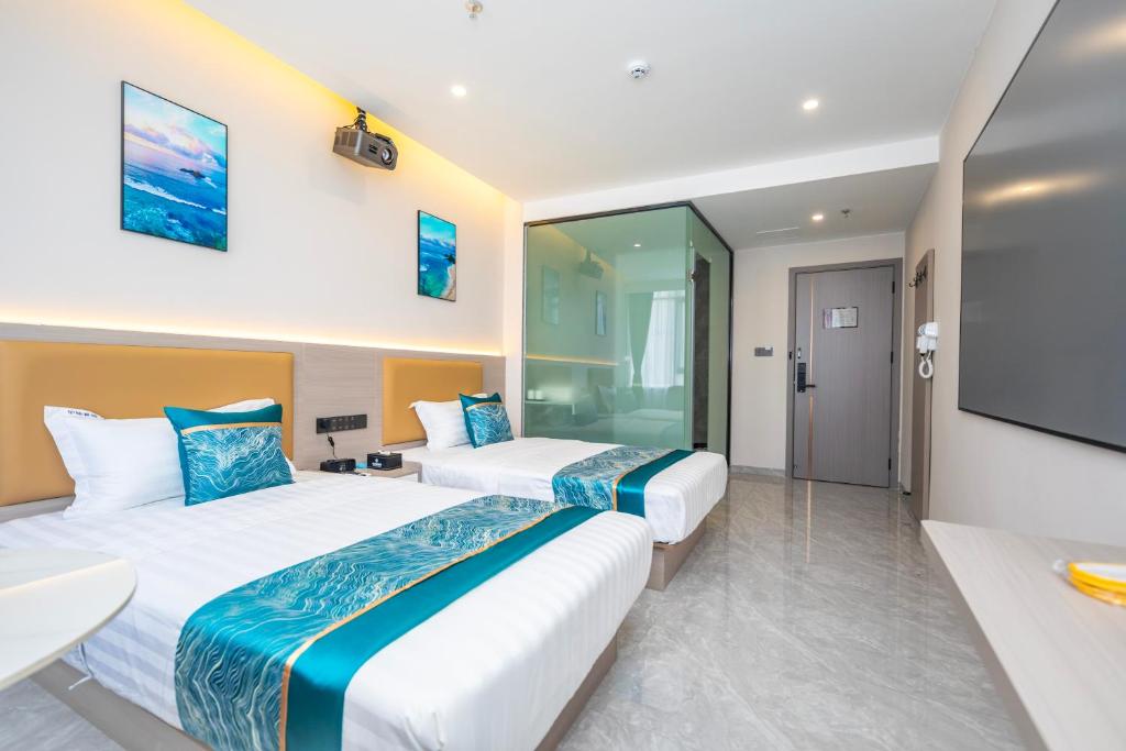 Postel nebo postele na pokoji v ubytování Zhuhai Xiangzhou Yijing Express Hotel