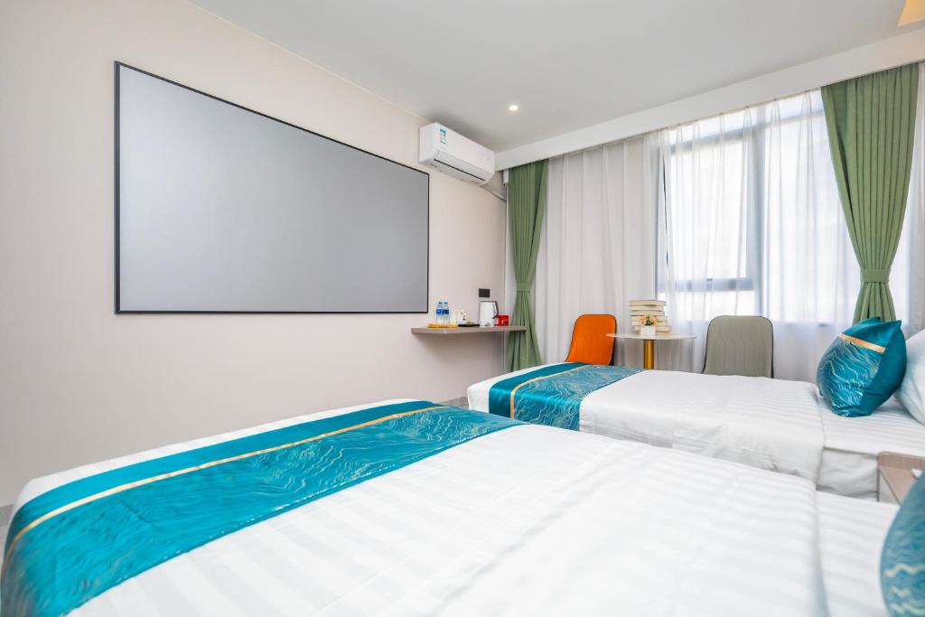 Postel nebo postele na pokoji v ubytování Zhuhai Xiangzhou Yijing Express Hotel