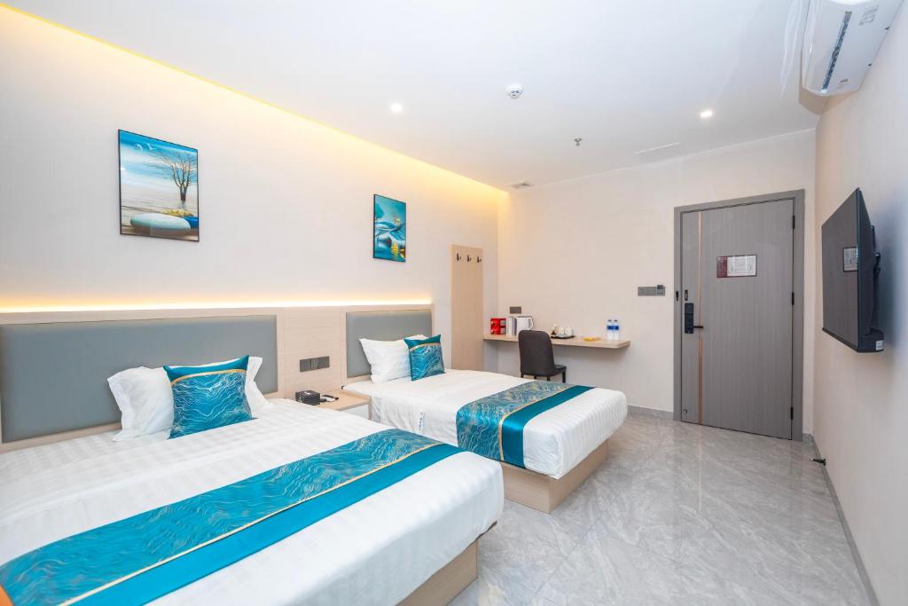 Postel nebo postele na pokoji v ubytování Zhuhai Xiangzhou Yijing Express Hotel