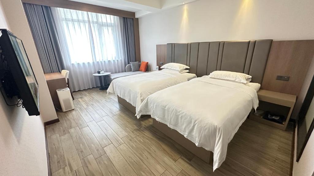 Postel nebo postele na pokoji v ubytování Bestway Hotel Xi'an