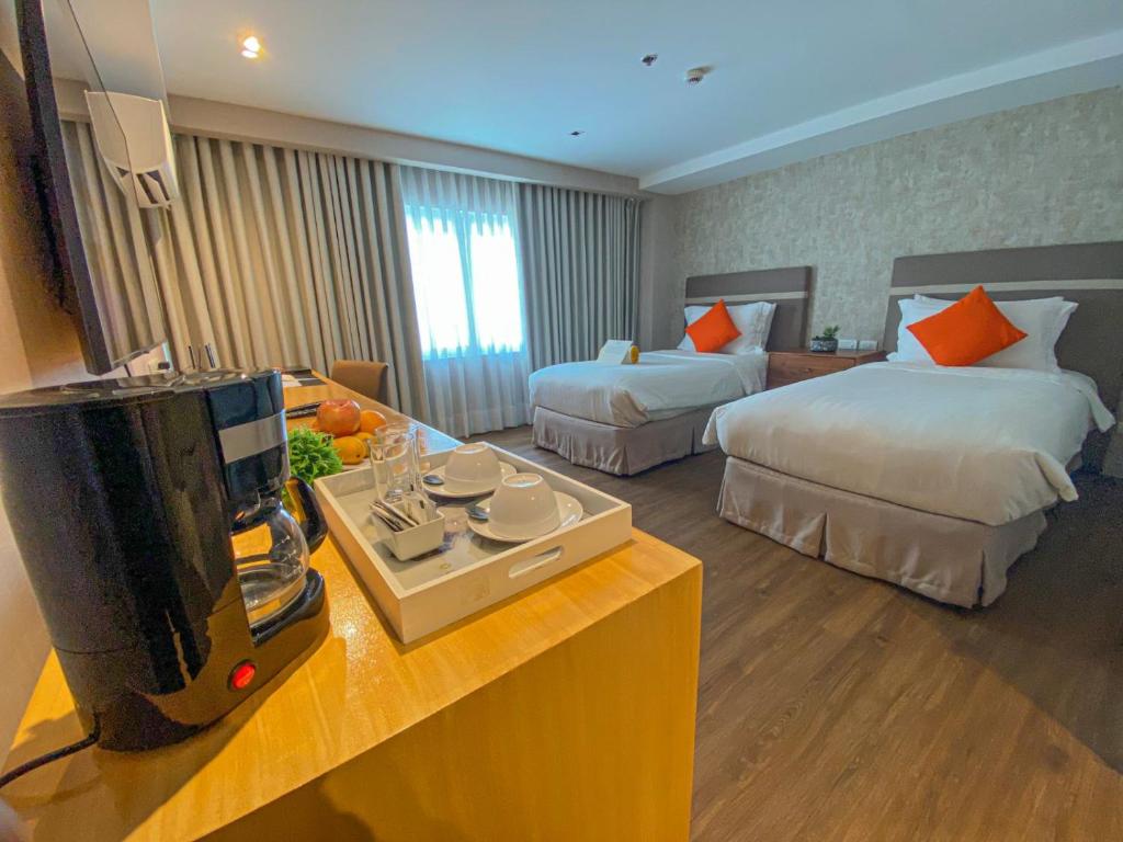 Postel nebo postele na pokoji v ubytování Hotel St. Ellis