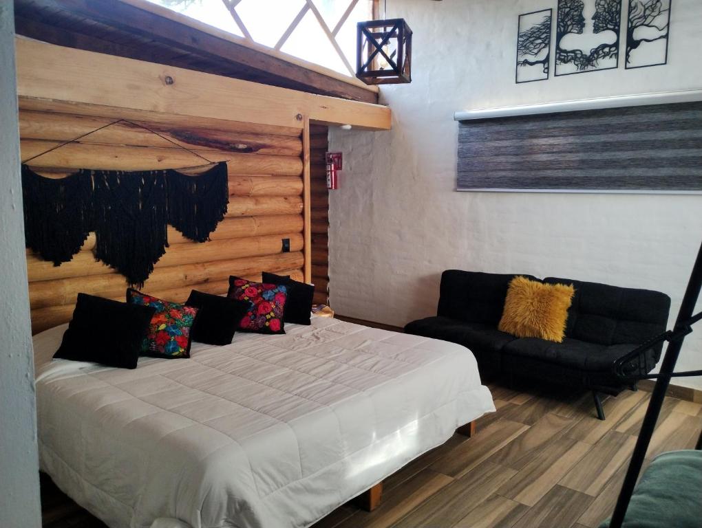 Postel nebo postele na pokoji v ubytování SENDERO REAL Mazamitla 3