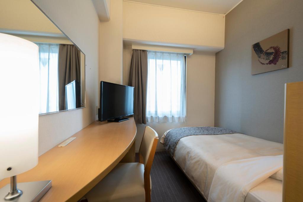 TV a/nebo společenská místnost v ubytování Hotel Binario Umeda