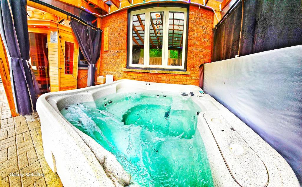 a jacuzzi tub in the middle of a house at 70 percent Off Luxurious Hot Tub,Sauna, 2000Sqft of Private in Vaughan
