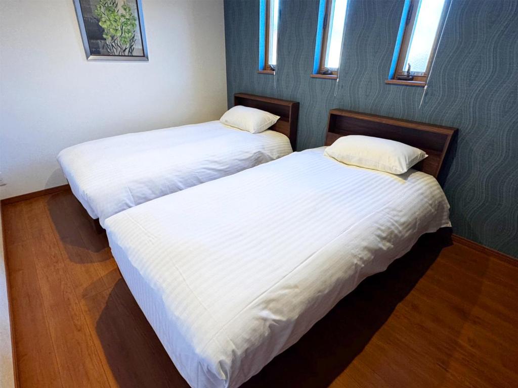 Postel nebo postele na pokoji v ubytování Glamping Cottage Kawaguchiko