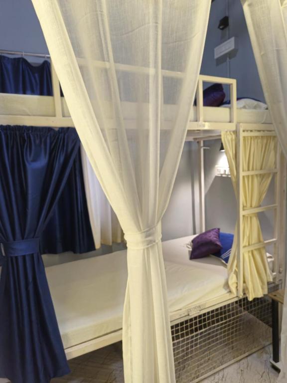 Postel nebo postele na pokoji v ubytování Faith Dorms