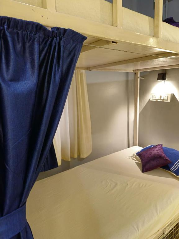 Postel nebo postele na pokoji v ubytování Faith Dorms