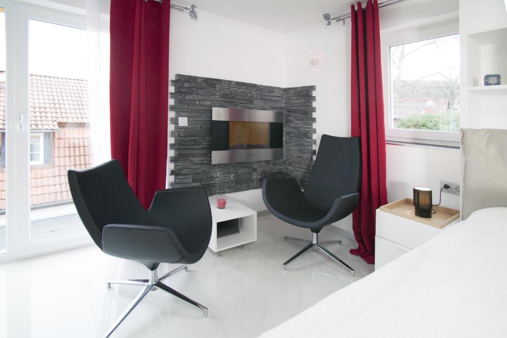 TV a/nebo společenská místnost v ubytování Designpension Idyll Nr21 Hotel Garni
