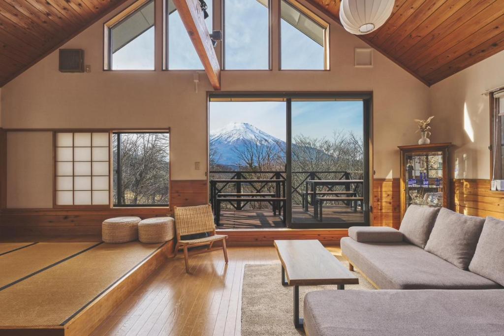 a living room with a view of a mountain at プライベートリゾート富士 in Yamanakako