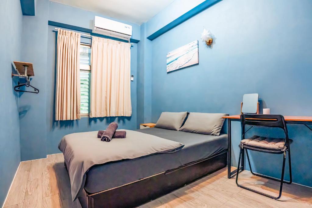 Postel nebo postele na pokoji v ubytování Green Island Ocean Rhythem dive B&B 綠島海韻民宿