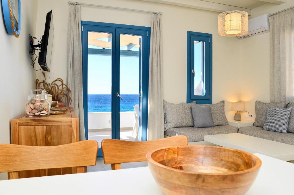 a living room with a view of the ocean at Sohoro in Koufonisia