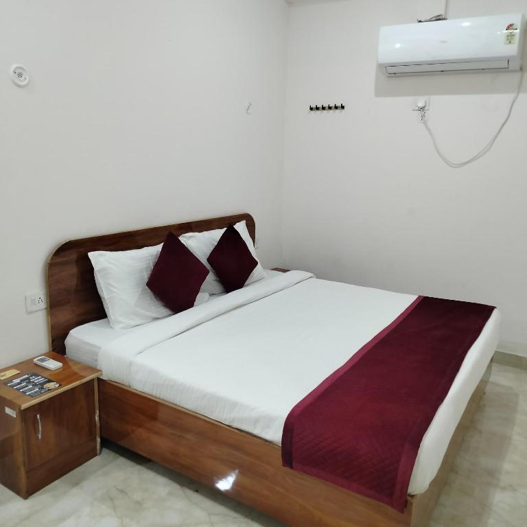 Postel nebo postele na pokoji v ubytování Hotel royal town