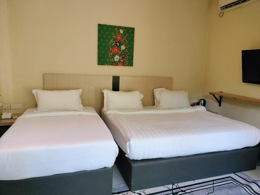 Postel nebo postele na pokoji v ubytování The Firefly Resort