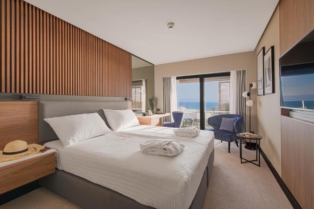 Postel nebo postele na pokoji v ubytování Boutique Hotel Noemia