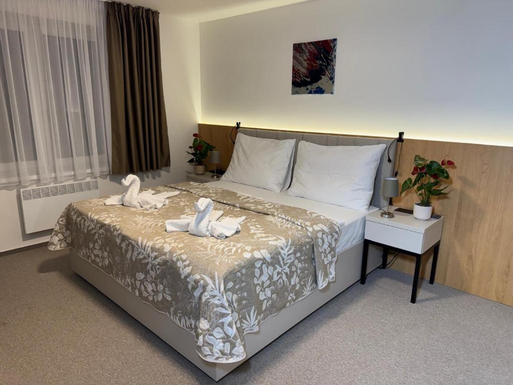 Postel nebo postele na pokoji v ubytování Comfort Pálava, Penzion Klentnice - Mikulov - Pálava