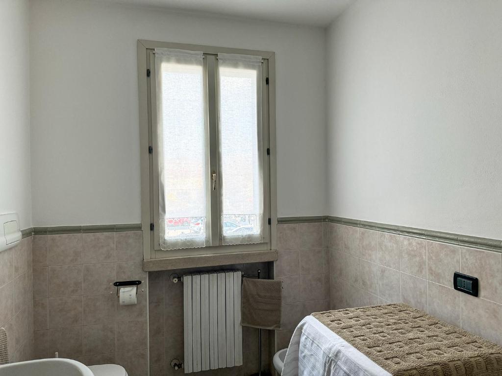 Postel nebo postele na pokoji v ubytování Residence Franciacorta