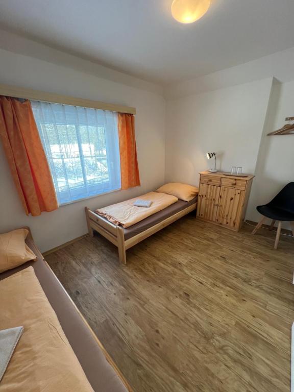 Postel nebo postele na pokoji v ubytování Penzion Star Doksy