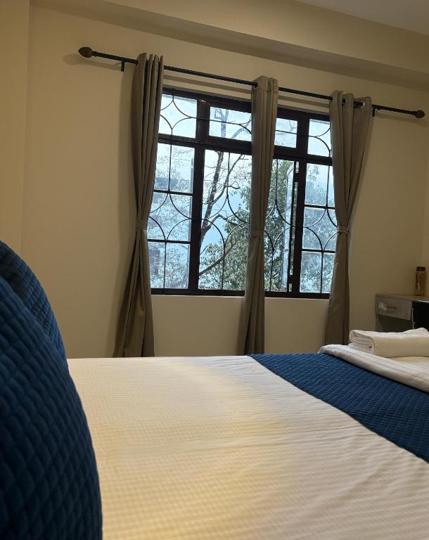 Postel nebo postele na pokoji v ubytování A Cube Homes