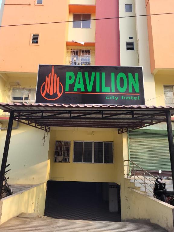 a sign on the side of a city hotel at Pavilion City Hotel in Nowgong