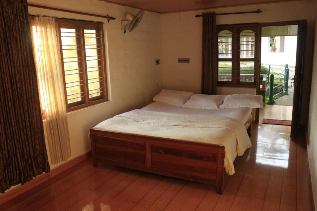 Postel nebo postele na pokoji v ubytování G0DS LAND Resort