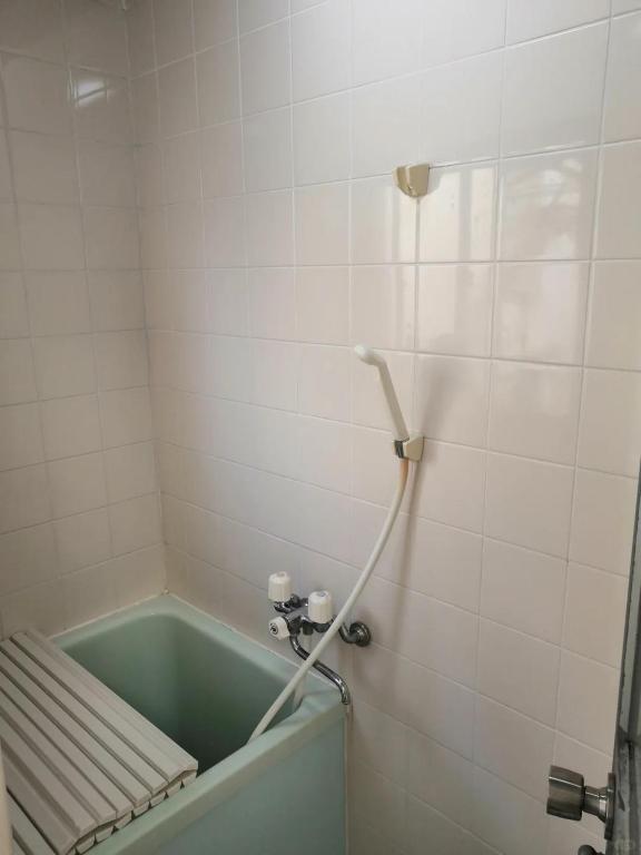 Ett badrum på Nippori Osaka Nishi-Tengachaya Guesthouse西天下茶屋アパートメント