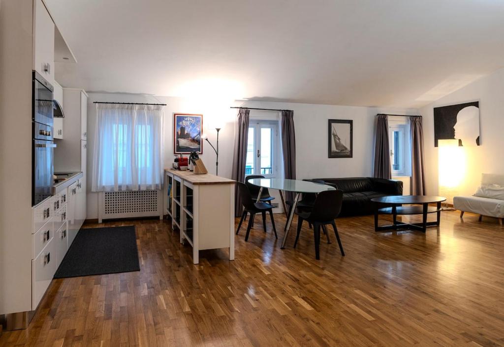 a living room with a table and a couch at Restart Accommodations Dea Roma in Rome