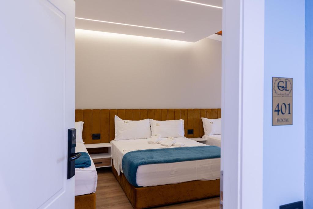 Postel nebo postele na pokoji v ubytování Golemi Lux Hotel