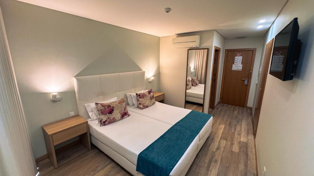 Een bed of bedden in een kamer bij Sea Garden Peniche