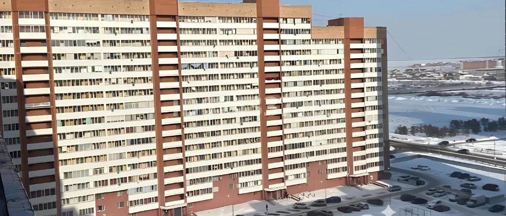 an architectural rendering of a tall building at Момышулы 28-433 уютно стильно in Fëdorovka
