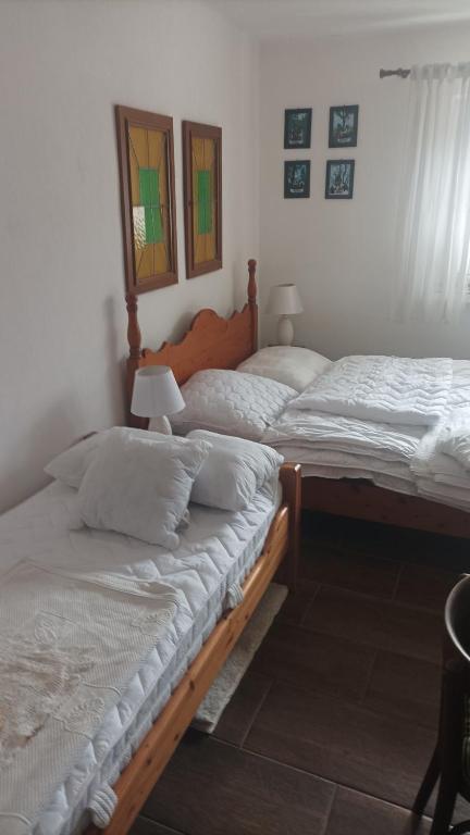 Posteľ alebo postele v izbe v ubytovaní Guesthouse Tulipán Vendégház