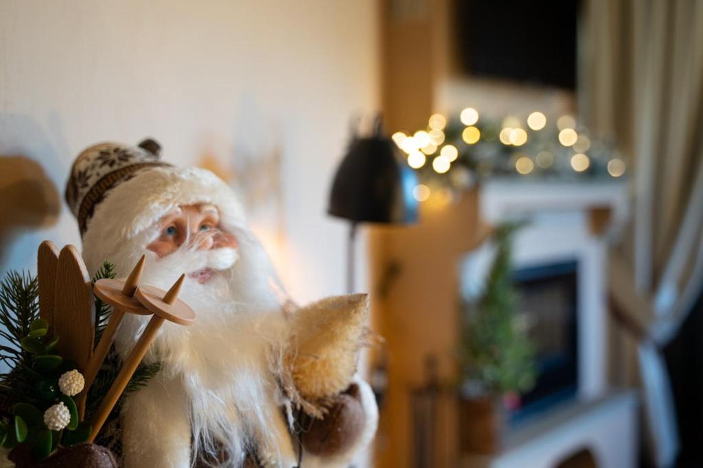 a santa claus figurine holding a piece of bread at Dandy Villas Metsovo - Avo - Fireplace - Up to 6 in Metsovo