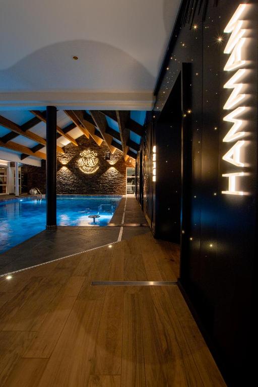 a swimming pool in the middle of a building at M&V Resort Camping in Langrune-sur-Mer