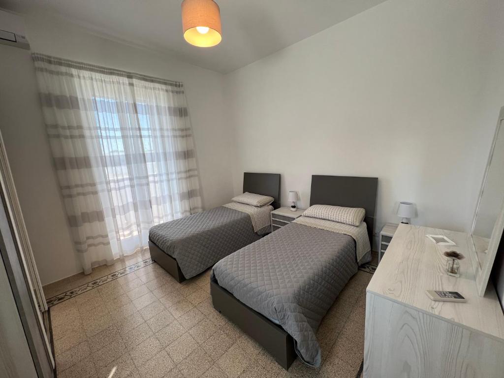 Posteľ alebo postele v izbe v ubytovaní Masseria Parco delle Casette
