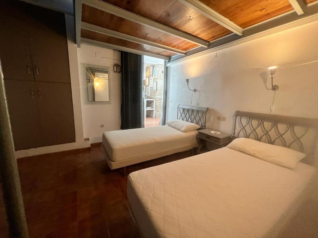 Postel nebo postele na pokoji v ubytování Casa con Encanto en Monachil