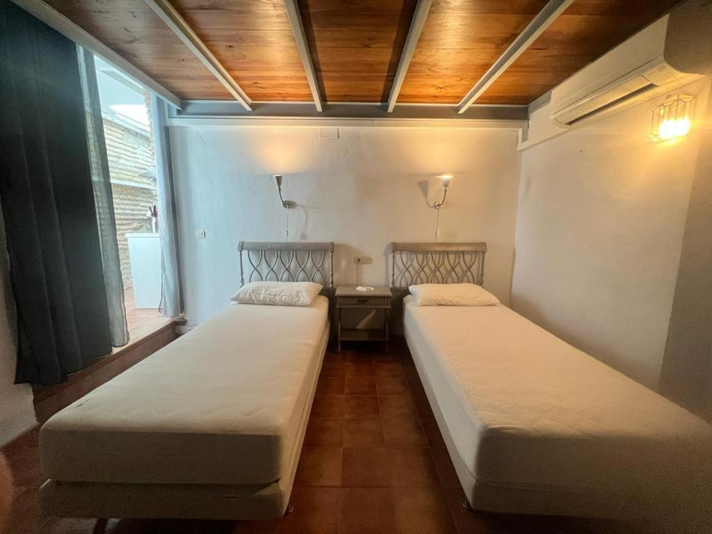 Postel nebo postele na pokoji v ubytování Casa con Encanto en Monachil