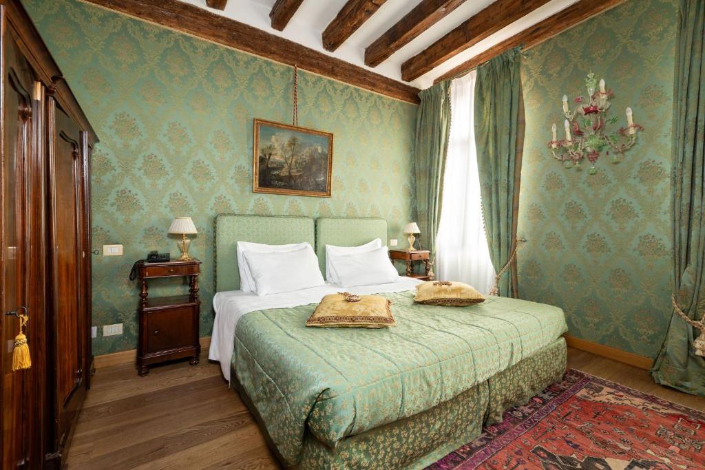 Postel nebo postele na pokoji v ubytování Relais Alberti