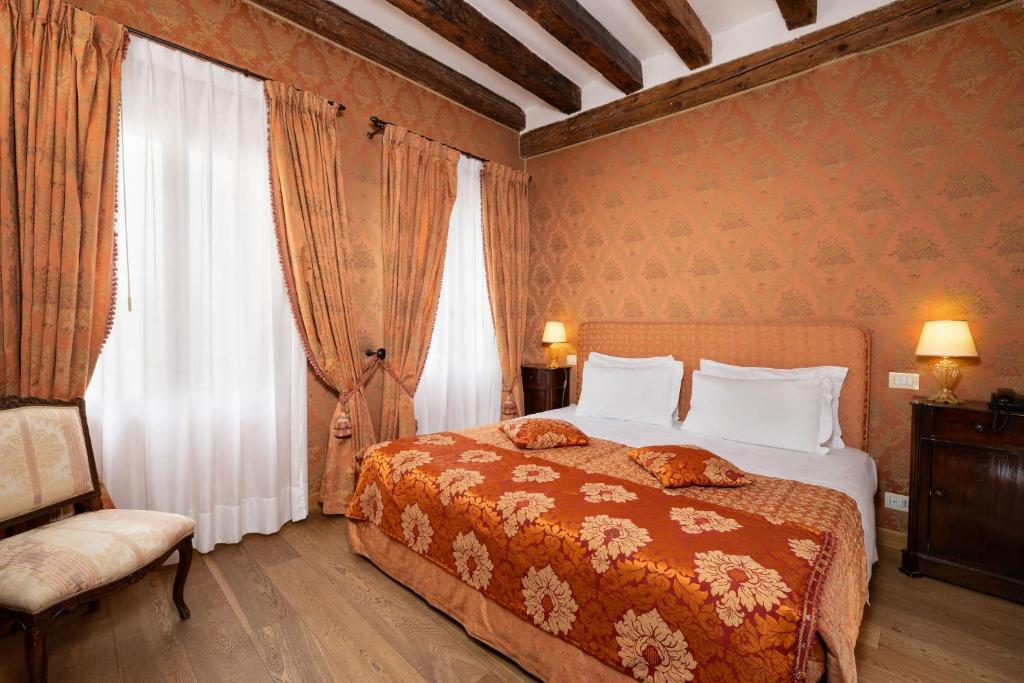 Postel nebo postele na pokoji v ubytování Relais Alberti