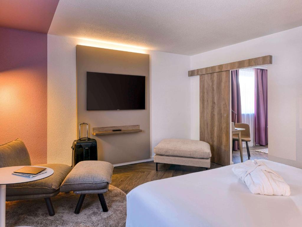 Postel nebo postele na pokoji v ubytování Novotel Zurich City West