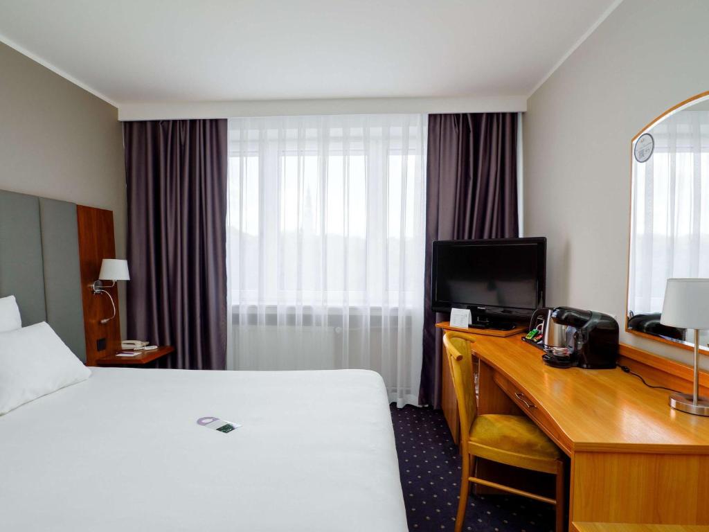 Posteľ alebo postele v izbe v ubytovaní Mercure Czestochowa Centrum