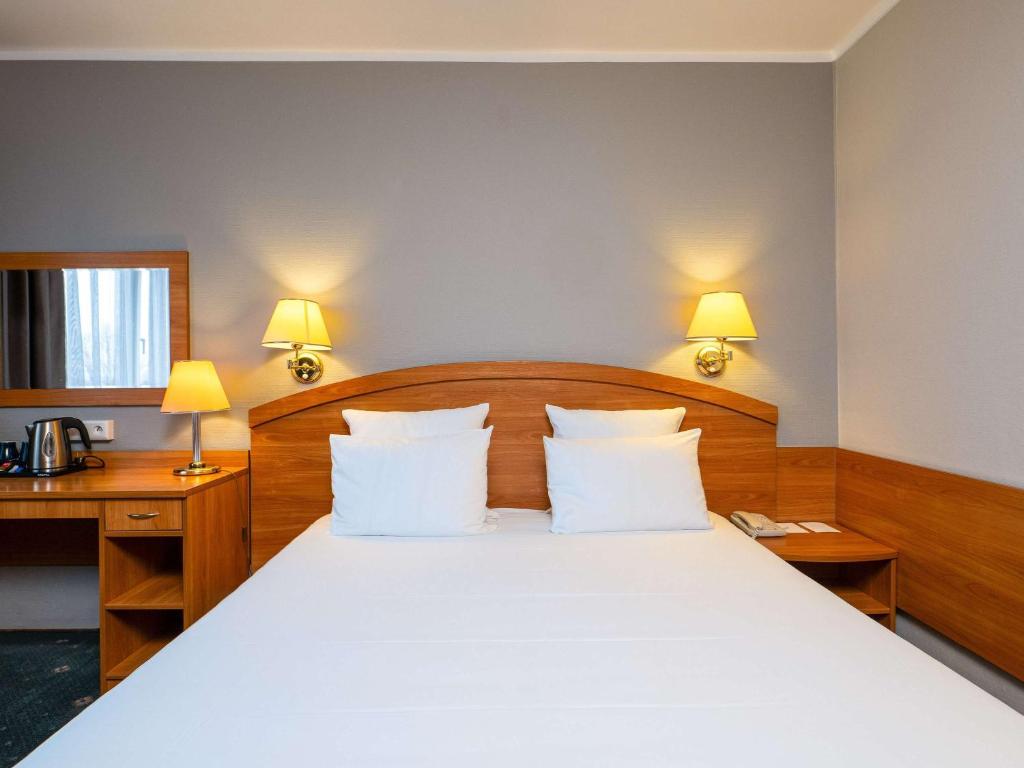 Posteľ alebo postele v izbe v ubytovaní Mercure Czestochowa Centrum